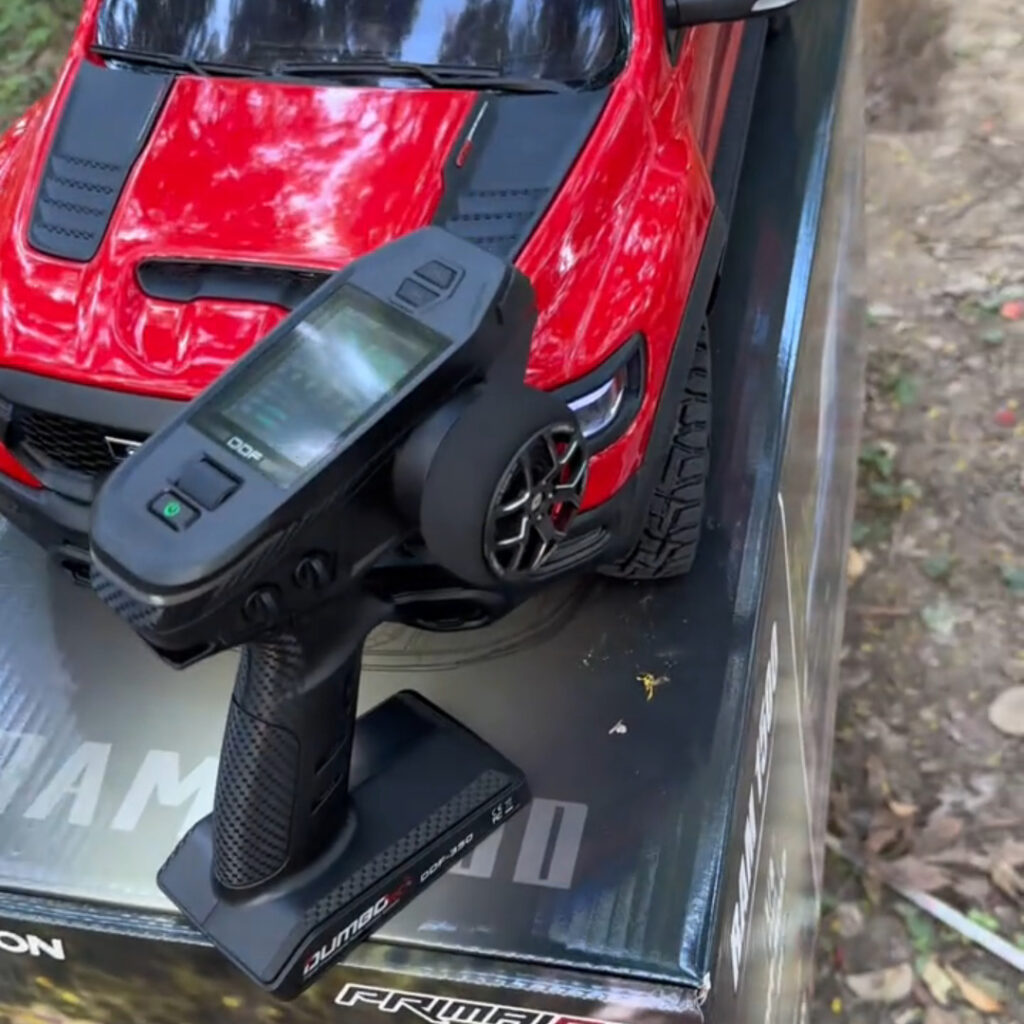 How to use the remote control for the Traction Hobby RAM 1500 brushed version?